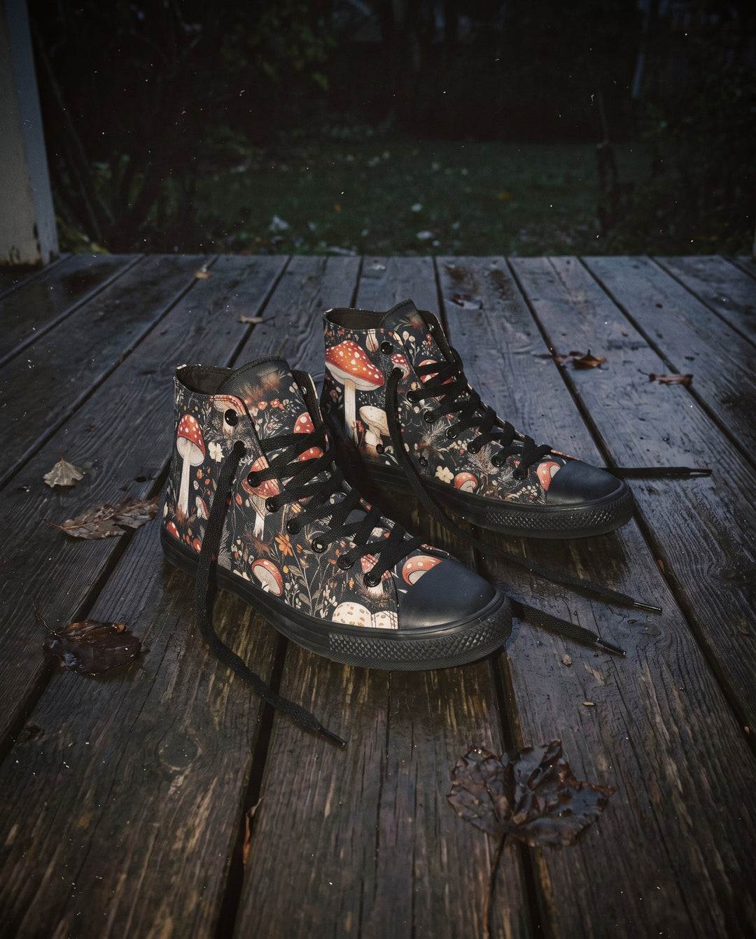 A pair of Amanita High Tops on a weathered wooden porch