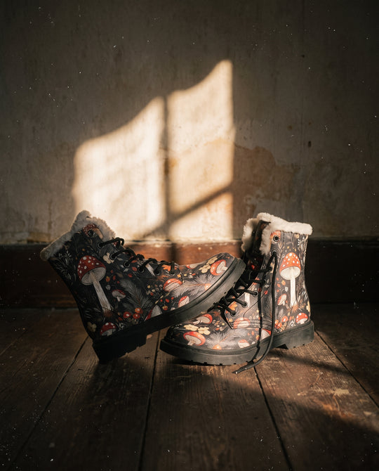 Amanita Winter Boots with faux fur lining on a wooden floor in window light