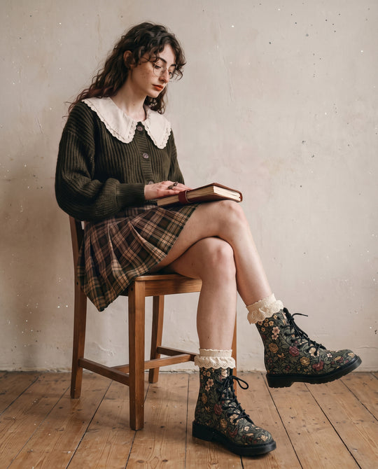 Ancient Orchard Boots worn seated with a book