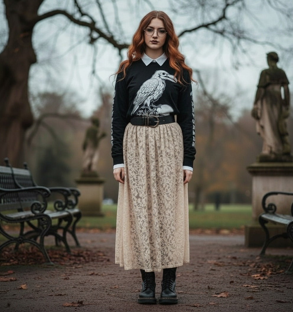 Woman standing in a park with statues and benches in the background