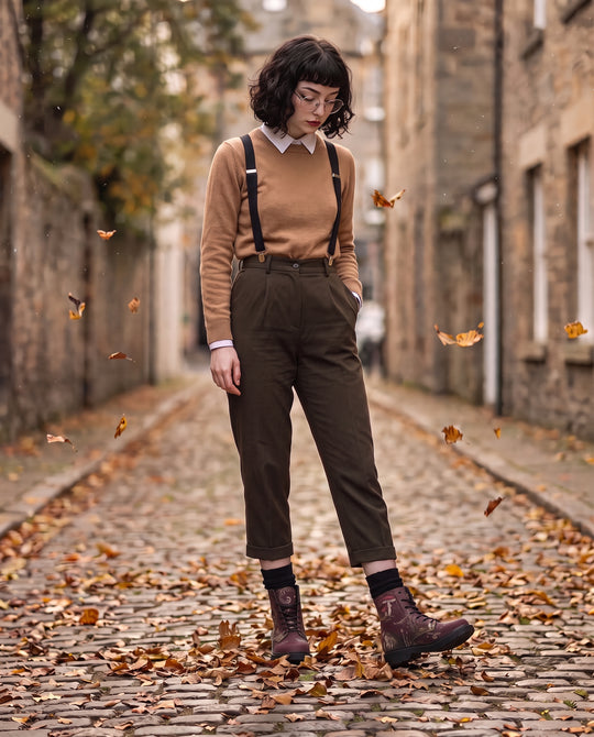 Fern Frenzy Boots on a cobbled street in falling leaves